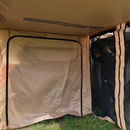 Beige tent with a partially open door on grass